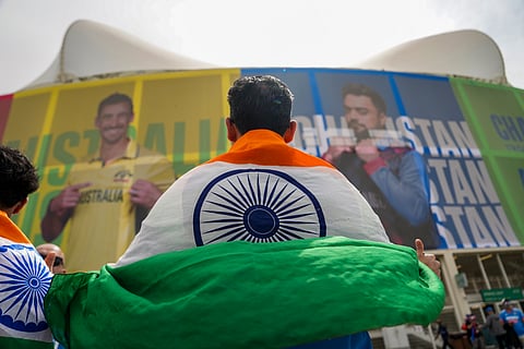 An Indian fan arrives to watch the ICC Champions Trophy 2025 final cricket match between India and New Zealand, at Dubai International Stadium, in Dubai, UAE, Sunday, March 9, 2025.