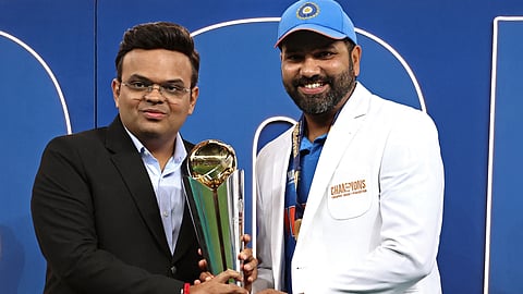 Chairman of ICC Jay Shah (L) presents the winning trophy to India's captain Rohit Sharma at the end of the ICC Champions Trophy ODI final cricket match between India and New Zealand at the Dubai International Stadium in Dubai on March 9, 2025.