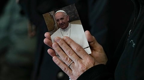 A nun attends a rosary prayer for Pope Francis in St. Peter's Square at the Vatican, Monday, March 10, 2025.