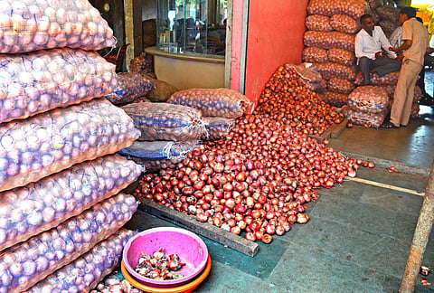 As many as 15 farmers climbed atop a water tank to protest the drop in prices of onion and also stalled its auctions for sometime on Monday.