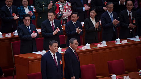 Chinese President Xi Jinping, left, and Premier Li Qiang during the closing session of the National People's Congress (NPC) at the Great Hall of the People in Beijing, China, Tuesday, March 11, 2025.