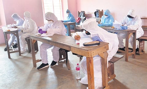 Covid-positive students writing an SSLC exam at a specially designated hall in Thiruvananthapuram