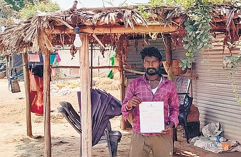 A bewildered J Venkateswarlu shows the notice demanding Rs 22,86,014 GST