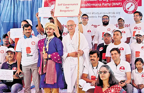 Members of Bengaluru NavaNirmana Party participate in a rally and day-long fast against Greater Bengaluru Governance Bill by the state government, at Freedom Park in Bengaluru on Sunday.