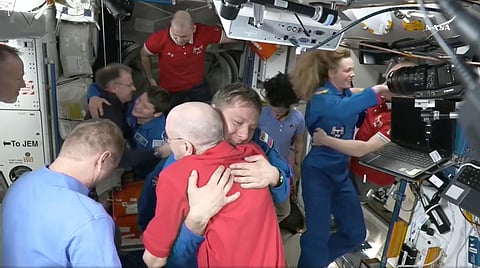 This image made from video by NASA shows astronauts Don Pettit, bottom center, hugging Kirill Peskov as astronauts greet each other after a SpaceX capsule docked with the International Space Station, Sunday, March 16, 2025.