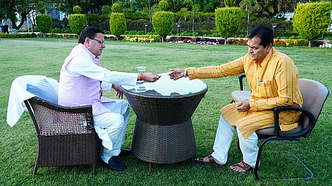 Uttarakhand Finance Minister Premchand Aggarwal submits his resignation letter to the Chief Minister Pushkar Singh Dhami.