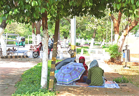 Worker taking rest under the tree on at Wednesday afternoon in Bhubaneswar.