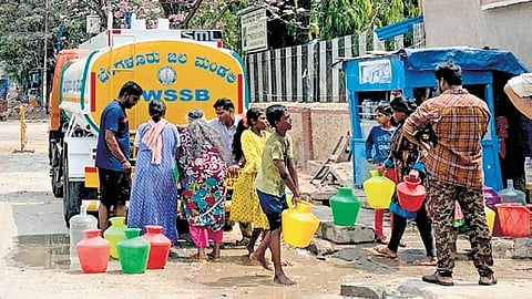 Residents of Narayanaswami Layout on JC Road collect water from a BWSSB tanker.