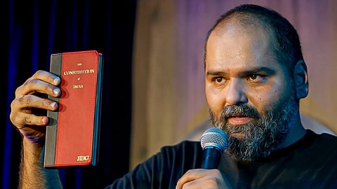 The Maharashtra government has warned of stern action against stand-up comedian Kunal Kamra for his satirical remarks on Deputy Chief Minister Eknath Shinde, calling him a “traitor.”