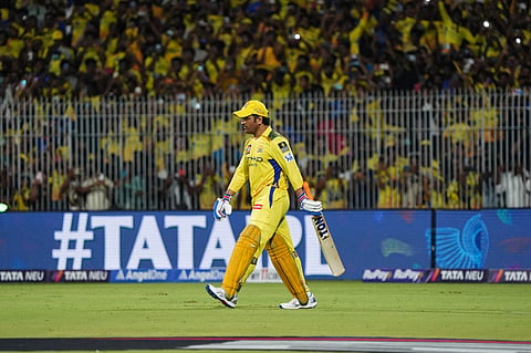 MS Dhoni walks in to bat