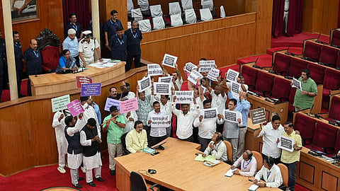 Congress and BJD MLAs stage a protest in the House during the Budget session of Odisha Assembly, in Bhubaneswar, Tuesday, March 25, 2025.