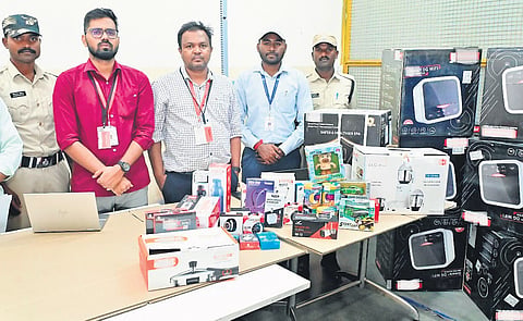 BIS officials with consumer goods seized from Amazon warehouse on Wednesday