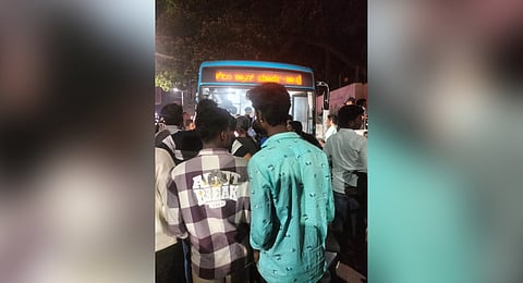 People gather around the BMTC bus involved in the accident on Old Airport Road on Wednesday