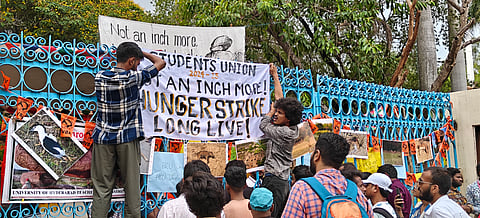 Students of University of
Hyderabad protest against the Land auction issue inside the campus at Gachibowli in Hyderabad on Thursday