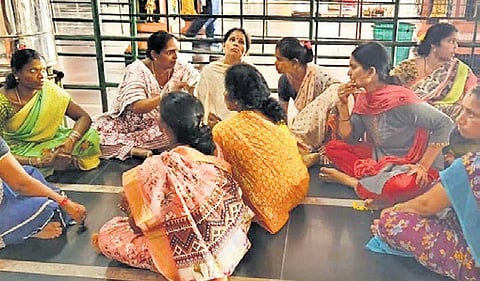 Outsourcing staff stage a protest at Arasavalli temple on Saturday.