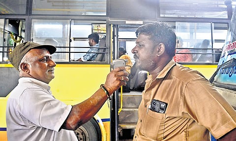 An MTC bus driver takes a breathalyser test in Koyambedu.