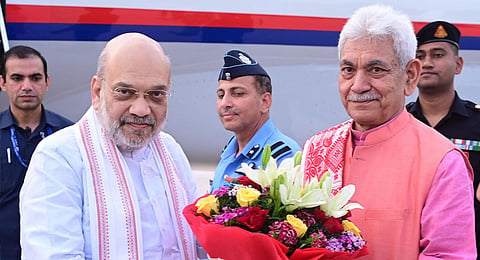 Union Home Minister Amit Shah being welcomed by Jammu and Kashmir Governor Manoj Sinha upon his arrival in Jammu.