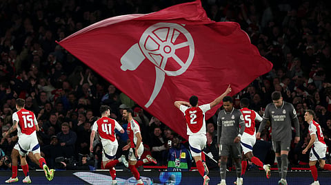Arsenal's Spanish midfielder #23 Mikel Merino (centre right) celebrates scoring the team's third goal during the UEFA Champions League Quarter final first leg football match between Arsenal and Real Madrid, at the Emirates Stadium, in London, on April 8, 2025.