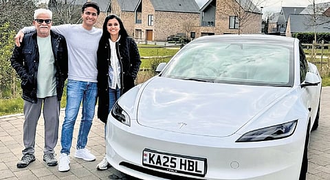 Sandeep Hoskoti poses with his family in front of his car with unique registration number at Chelmsford in UK