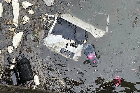 Debris floats in the water at the scene where a helicopter crashed into the Hudson river, Thursday, April 10, 2025, in Jersey City, N.J.