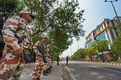 Security personnel stand guard near the National Investigation Agency (NIA) headquarters in New Delhi where Rana is being grilled
