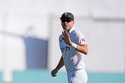 James Anderson gestures to the crowd after taking his 700th wicket on the third day of the fifth and final Test between England and India in Dharamshala on March 9, 2024 (Photo | AP)