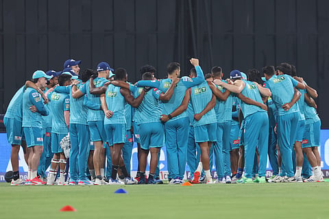 Lucknow Super Giants players huddle before their match against Chennai Super Kings at Atal Bihari Vajpayee Ekana Stadium in Lucknow