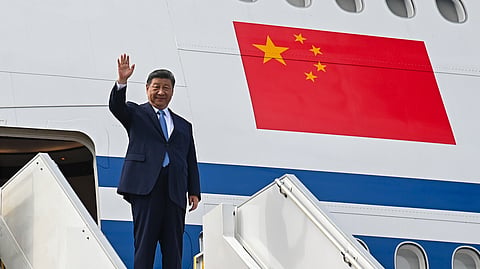 China's President Xi Jinping waves upon his departure to Cambodia at the Kuala Lumpur International Airport in Sepang, Malaysia, on Thursday, April 17, 2025.