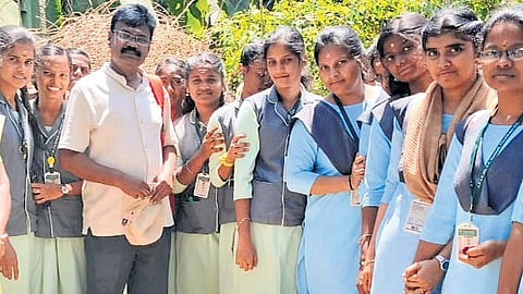 V Narayanan Moorthy explains the importance of inscriptions and archaeology to the school students in Dindigul.