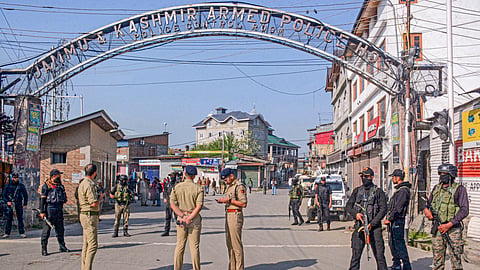 Security personnel stand guard at the Police Control Rooom, where bodies of Pahalgam terrorist attack were shifted, in Srinagar, Wednesday, April 23, 2025.