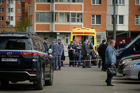 Police and investigators work at the scene where Lt. Gen. Yaroslav Moskalik was killed by an explosive device placed in his car just outside Moscow (Photo | AP)