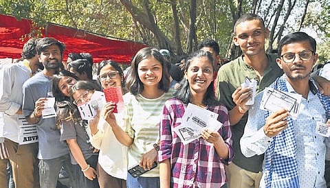Students queue up to cast their votes for the JNUSU elections