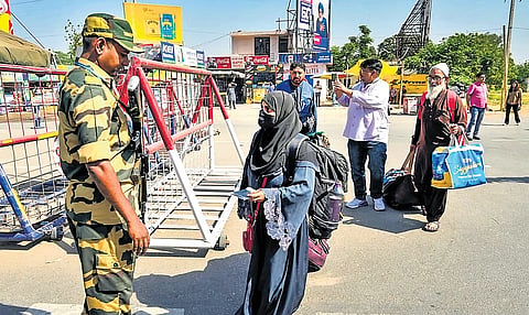 Pakistani nationals arrive at the Integrated Check Post at the Attari-Wagah border.