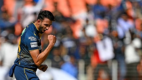 Gujarat Titans' Prasidh Krishna celebrates after taking the wicket of Delhi Capitals' KL Rahul during the Indian Premier League (IPL) Twenty20 cricket match between Gujarat Titans and Delhi Capitals at the Narendra Modi Stadium in Ahmedabad on April 19, 2025.