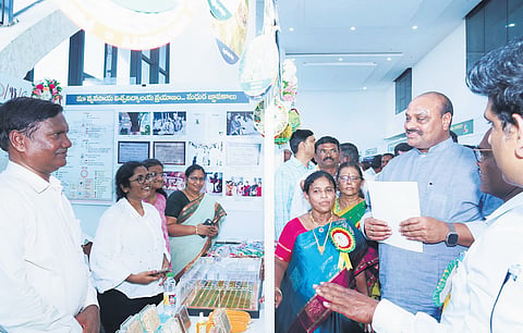 Agriculture Minister K Atchannaidu going round the stalls set up for Diamond Jubilee celebrations of ANGRAU on Tuesday.