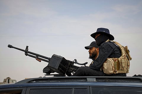 Syria's security forces are deployed at a highway where they found bodies of Syrian Druze fighters who were in a convoy heading from the southern Sweida province towards the capital, at al-Sor al-Kobra village near the Sweida town, southern Syria, Thursday, May 1, 2025.
