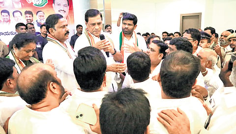 Congress workers argue with MP Suresh Shetkar, MLA T Rammohan Reddy and other party leaders during a meeting organised in Sangareddy on Sunday.