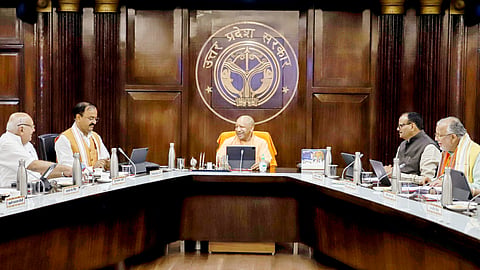 Uttar Pradesh Chief Minister Yogi Adityanath chairs a cabinet meeting, at Lok Bhawan in Lucknow on Tuesday.