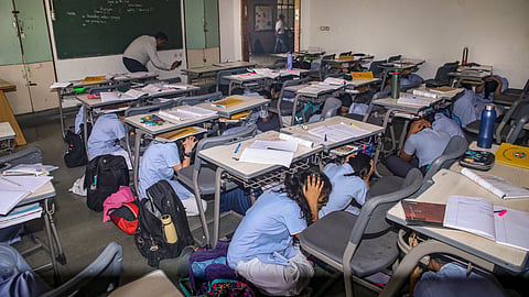 School students take part in a drill as part of a nationwide civil defence drill, in Noida, Wednesday, May 7, 2025.