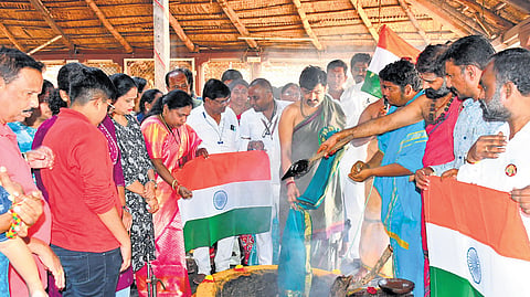 Devotees participate in Chandi Homam being performed by priests at the Bhadrakali Temple in Warangal on Monday