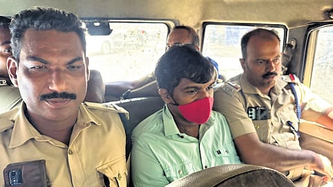 Police escort Cadell Jeanson Raja, found guilty in the Nanthancode mass murder case, out of the Vanchiyoor court in Thiruvananthapuram on Monday