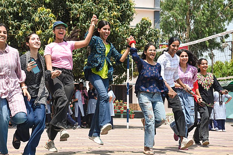 Class 12 students celebrate after CBSE declared the board exam results, in Moradabad, Tuesday, May 13, 2025.