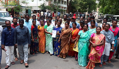 Mosquito eradication workers petition Vellore Collector VR Subbulaxmi in Vellore on Monday, demanding the implementation of a government-mandated wage hike from Rs 325 to Rs 529 per day