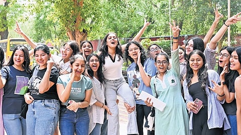 Class 12 students celebrate after the results in New Delhi on Tuesday
