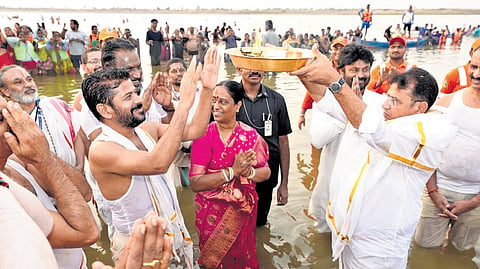 Chief Minister A Revanth Reddy performs rituals at the Triveni Sangam on the first day of Saraswathi Pushkaralu near Kaleshwaram on Thursday