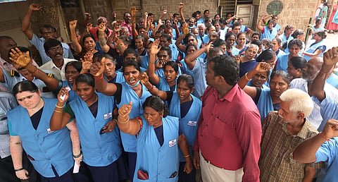 Contract workers protest at Madurai Government Rajaji Hospital condemning the recent action of dismissing many workers citing age as reasons, staged a protest in Madurai on Wednesday.