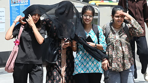 Visitor out on hot afternoon at Connaught Place, on May 14, 2025 in New Delhi.