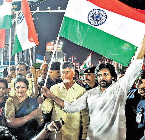 CM N Chandrababu Naidu, Deputy CM Pawan Kalyan, and BJP State president D Purandeswari hold the national flag during the ‘Tiranga Rally’, held to mark the success of ‘Operation Sindoor’ on the MG Road in Vijayawada on Friday