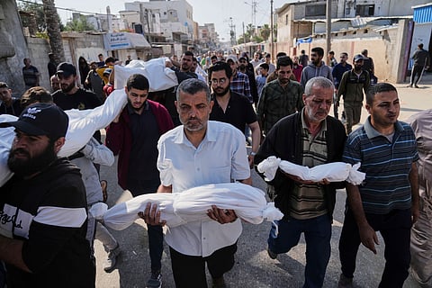 Palestinian carry the bodies of their relatives including children who were killed in an Israeli army airstrike in Deir al-Balah, Gaza, Wednesday, May 21, 2025.