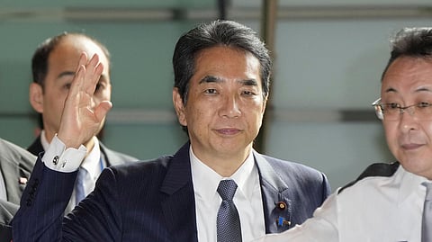 Japan's Agriculture Minister Taku Eto, centre, arrives at the prime minister's office in Tokyo on Wednesday, May 21, 2025.